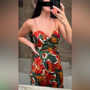 Sundress only worn once. Mid length with a slight split going up to the thigh.